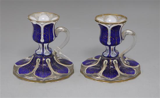 A pair of 19th century Bohemian blue flash cut chambersticks height 10cm